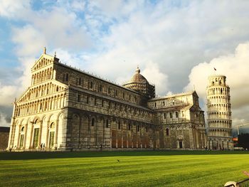 Low angle view of historical buildings against cloudy sky