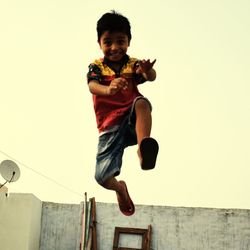 Portrait of boy jumping