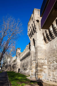 Low angle view of historical building against blue sky