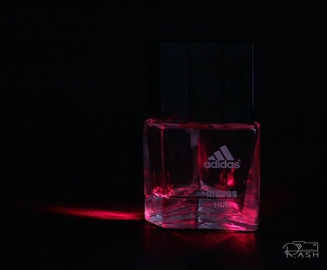 red, indoors, glass - material, illuminated, still life, close-up, table, transparent, drink, copy space, night, no people, drinking glass, studio shot, single object, refreshment, food and drink, dark, focus on foreground, glass