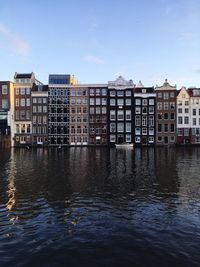 Buildings in city against sky