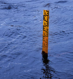 High angle view of sign on beach