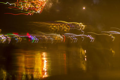 Close-up of illuminated lights in water at night