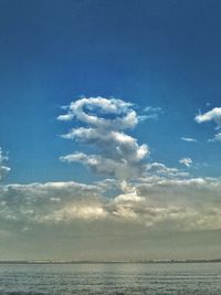 Scenic view of sea against blue sky