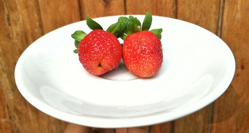 High angle view of strawberries in plate on table