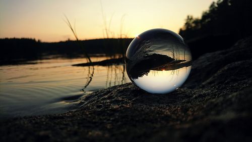 Close-up of crystal ball on water