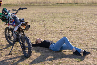 Woman motocross rider resting