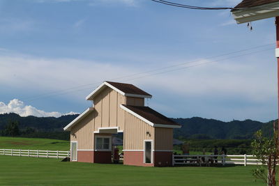 House on field against sky