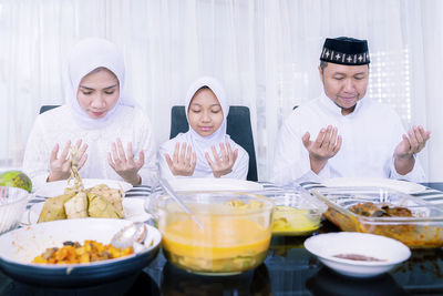 High angle view of people in bowl on table