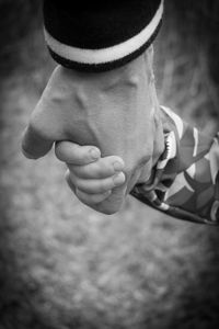 Close-up of couple holding hands