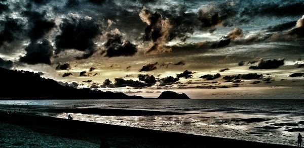 Scenic view of sea against dramatic sky