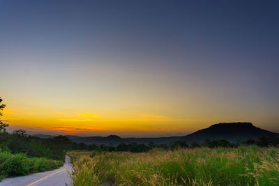 Scenic view of landscape against sky during sunset