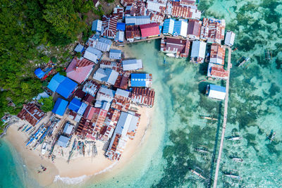 High angle view of buildings by sea