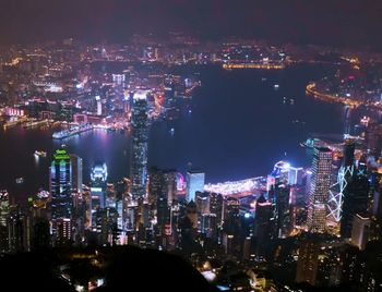 High angle view of illuminated city buildings at night