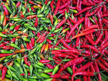 Full frame shot of red chili peppers at market