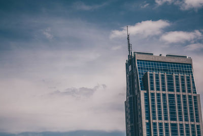 Low angle view of skyscraper against sky