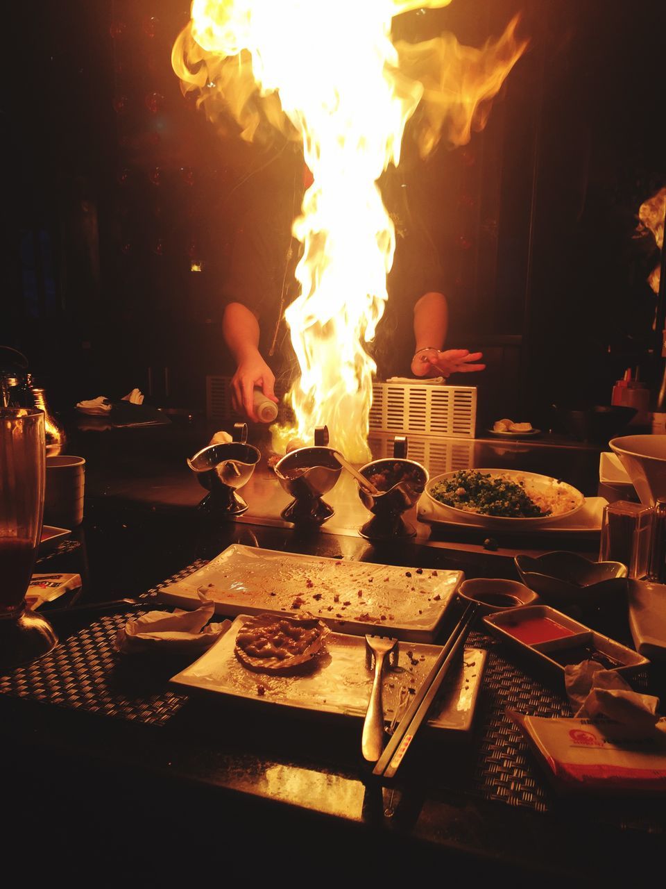 food and drink, food, table, indoors, freshness, night, restaurant, ready-to-eat, illuminated, plate, burning, flame, indulgence, still life, fire - natural phenomenon, meal, unhealthy eating, serving size, heat - temperature, no people