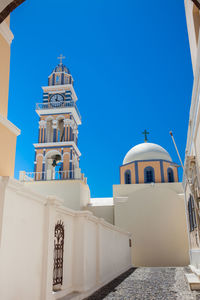 Low angle view of building against clear blue sky