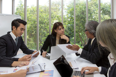 Business people discussing during meeting in office