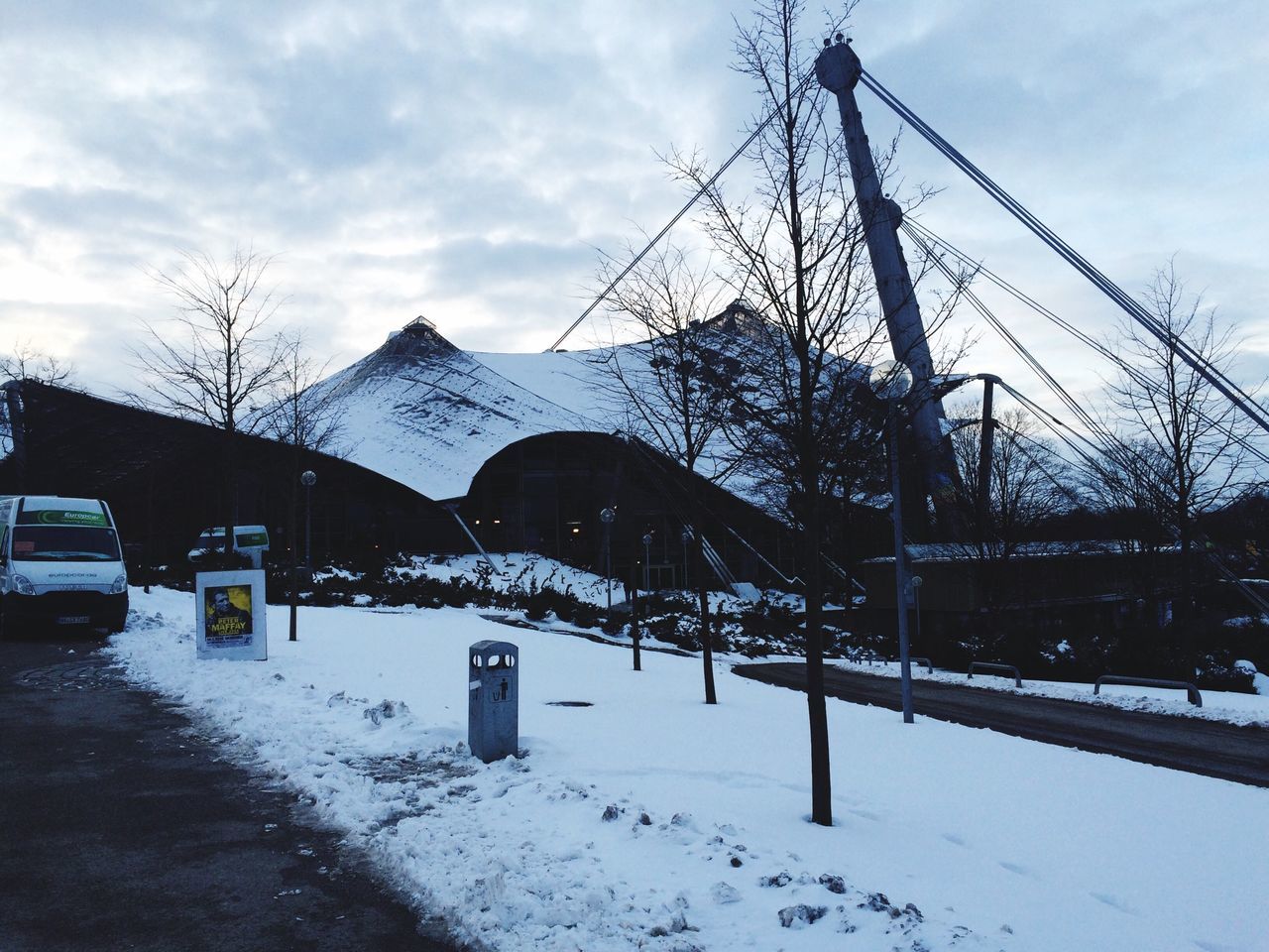 architecture, snow, built structure, building exterior, sky, winter, cold temperature, cloud - sky, bare tree, season, weather, house, tree, cloud, cloudy, residential structure, mountain, day, transportation, street