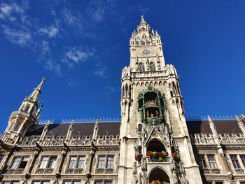 Low angle view of building against blue sky