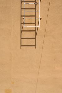 High angle view of empty chair against tiled floor