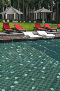 View of chairs in swimming pool