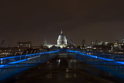 Illuminated city street at night