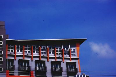 Low angle view of building against blue sky