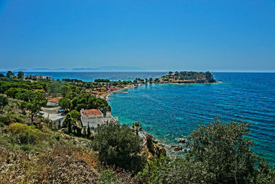 Scenic view of sea against clear blue sky