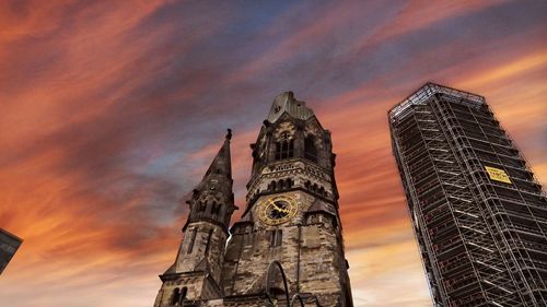 Low angle view of buildings against sky during sunset