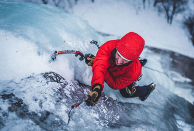 Person with umbrella on snow