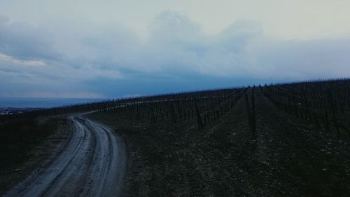 View of road against cloudy sky