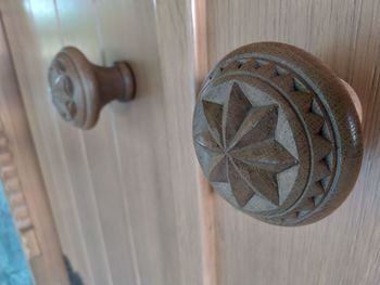 Close-up of door handle on table