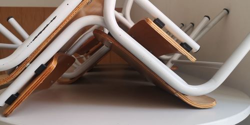 High angle view of empty chairs on table