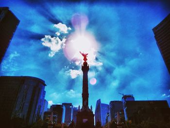 Low angle view of building against cloudy sky