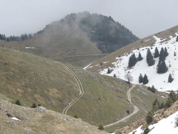 Scenic view of mountains against sky during winter