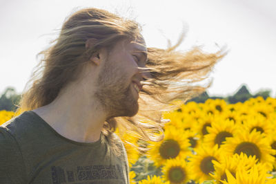 Portrait of man in sunflower field