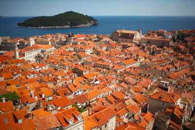 High angle view of residential district by sea