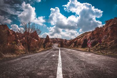 Surface level of empty road against sky