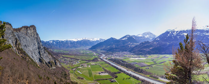 Scenic view of mountains against clear blue sky