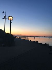 Scenic view of sea against clear sky at sunset