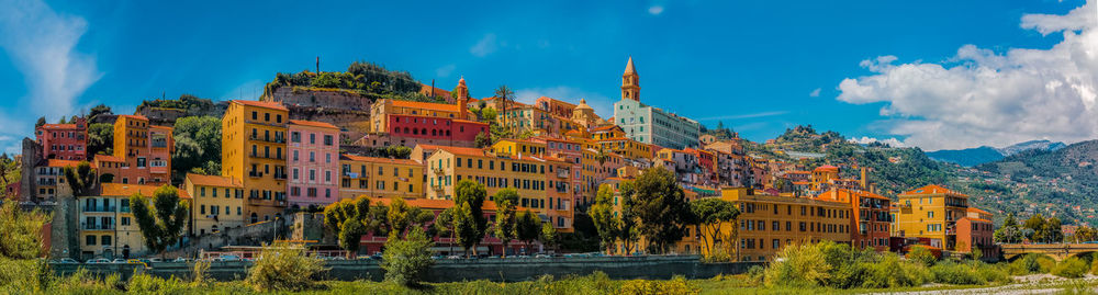Buildings in city against sky