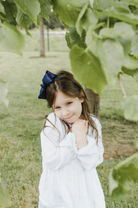 Portrait of smiling girl standing outdoors