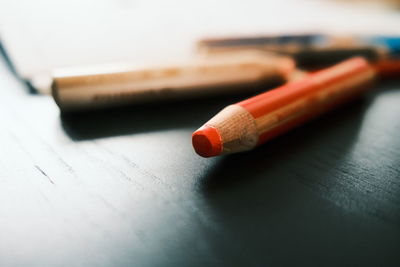 Close-up of colored pencils on table