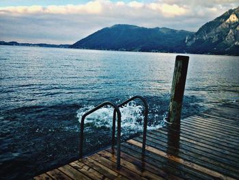 Scenic view of lake with mountains in background