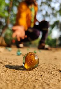 Close-up of man with ball on land