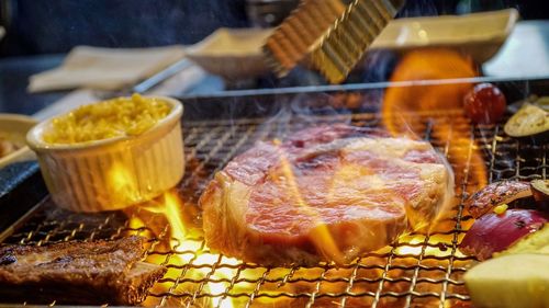 Close-up of meat on barbecue grill