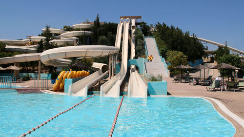 View of swimming pool against clear blue sky