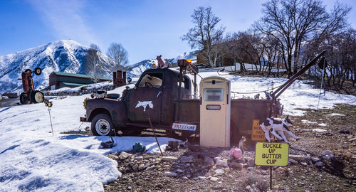 Low angle view of car on snow covered field